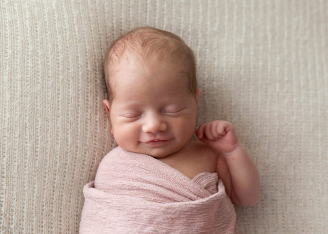 newborn baby smiling perth